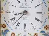a clock that is sitting in a box on the table