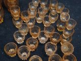 a lot of glasses and spoons on the table