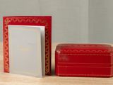 a small red box and a small red box on a table