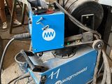 a machine that is sitting on the ground in the garage