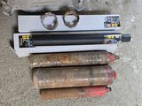 three different types of gas canisters sitting on the ground