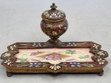 a small decorative box with a lid on a table