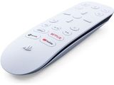 a close up of a remote control on a white surface