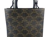 a brown and black handbag on a white background