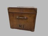 a brown suitcase with a metal handle on a gray background