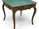 an old wooden table with a green top on a white background