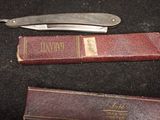 a knife and a book sitting on a table
