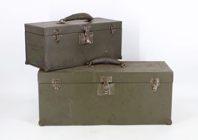 two suitcases sitting on top of each other on a white surface