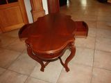 a wooden table with a drawer underneath it on the floor