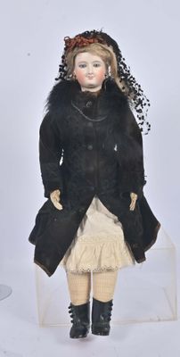 a small doll that is sitting on a clear box