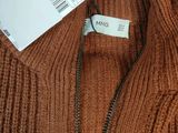 an image of a brown sweater with a tag on it