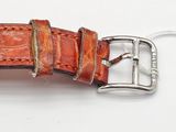 a brown leather watch strap with a silver buckle on it