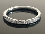 an image of a diamond ring on a reflective surface