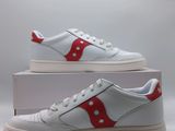 a pair of white sneakers with red and white stripes