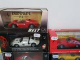 several toy cars are stacked on top of each other on a table