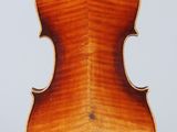 an old violin with a wooden back and a long neck
