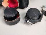 a camera and a camera case sitting on a table