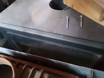 a stove that has some kind of wood in it