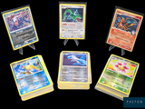 cinq types différents de cartes Pokémon présentées sur un fond noir