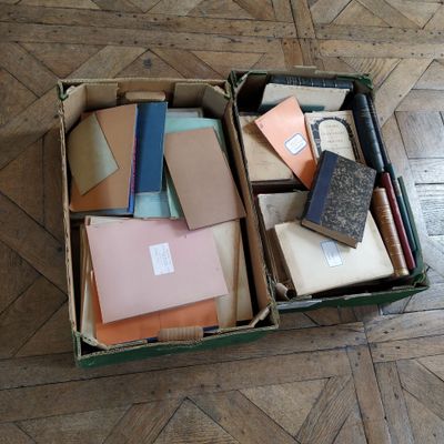a box full of books sitting on the floor