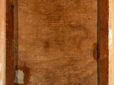 an old wooden frame with a hole in the middle of it