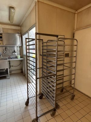 an image of a kitchen with a rack of food in it