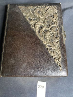 an old leather case with a decorative design on the front