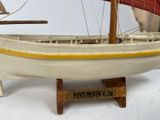 a small model of a boat on a table