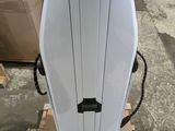 an image of a white surfboard sitting on top of a pallet