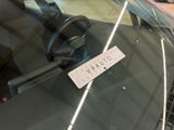 a sticker on the windshield of a car that says corona