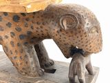 a statue of a leopard with a hat on it ' s head