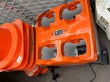 two chainsaws that are sitting next to each other