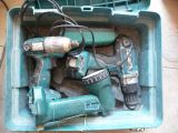 many tools in a box that are sitting on the floor