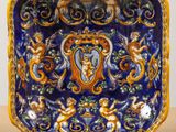 an image of a blue and yellow plate with angels on it