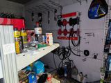 a room with a lot of tools and supplies on the wall