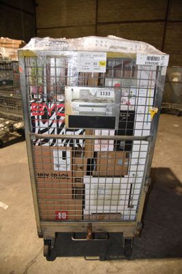 a cart with a bunch of boxes on it in a warehouse