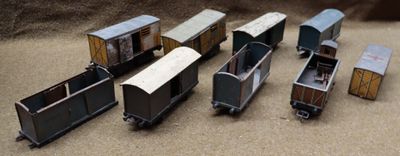 six toy trains that are sitting on a table