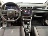 a picture of the interior of a car with a steering wheel and dashboard