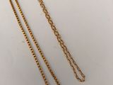 a gold necklace with a chain that is attached to it
