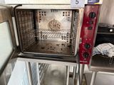 a red oven that is inside of a kitchen
