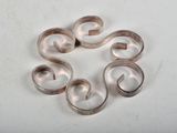 five silver rings arranged in a circle on a white surface