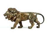 bronze statue of a lion on a white background