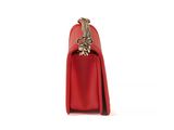 a red purse with a chain hanging from the handle