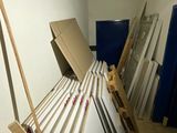 several pieces of wood are stacked up in a room