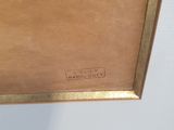 a painting of a gold frame with a picture on it