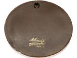 an image of a brown plate with a gold logo on it