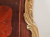 a marble top on a wooden cabinet with a marble top