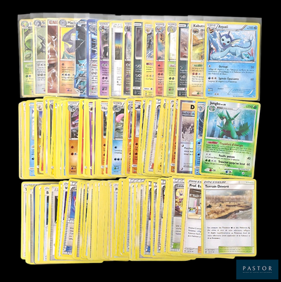 a lot of pokemon cards that are on the table