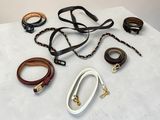 several different types of leather bracelets on a white surface