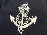 a close up of a t shirt with an anchor and rope on it